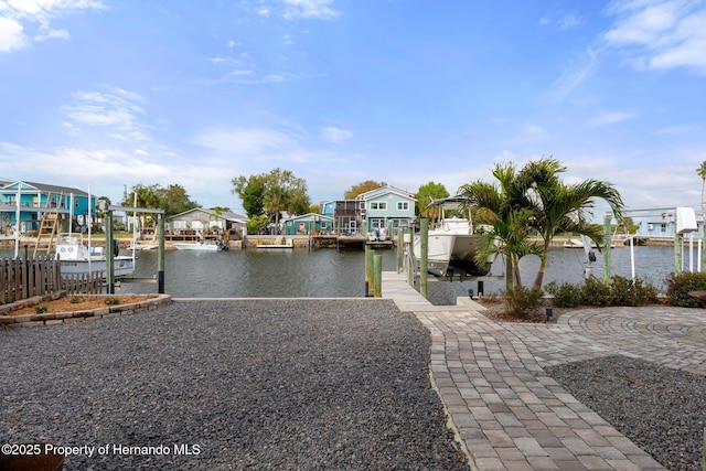 view of water feature with a residential view, a boat dock, and boat lift