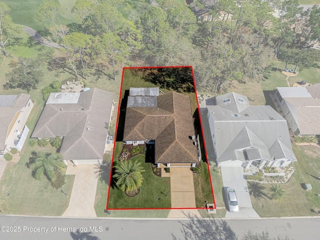 birds eye view of property with a residential view