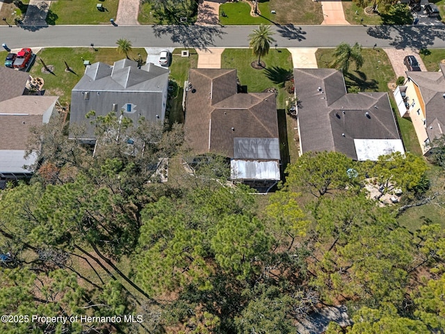 birds eye view of property with a residential view