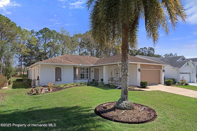 ranch-style home featuring concrete driveway, brick siding, an attached garage, and a front lawn