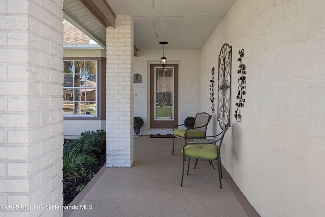 doorway to property with stucco siding