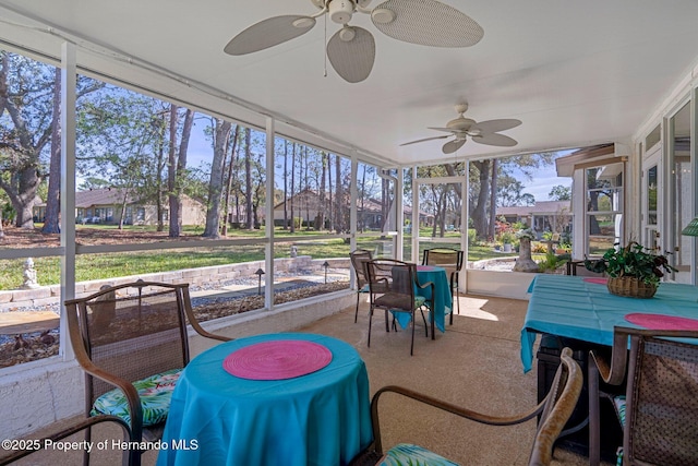 sunroom with a ceiling fan