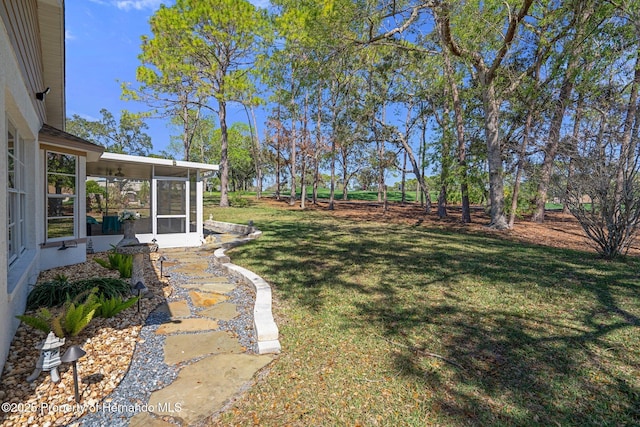 view of yard with a sunroom