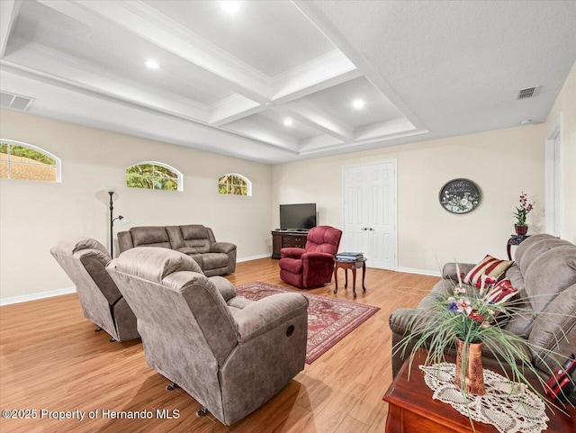 living room featuring beamed ceiling, crown molding, coffered ceiling, and light hardwood / wood-style floors