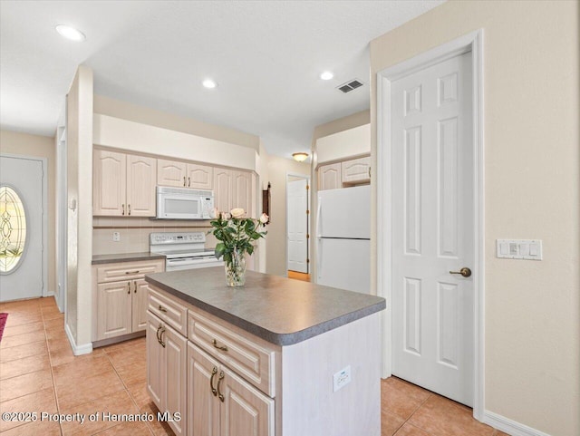 kitchen with a kitchen island, light tile patterned floors, white appliances, and decorative backsplash