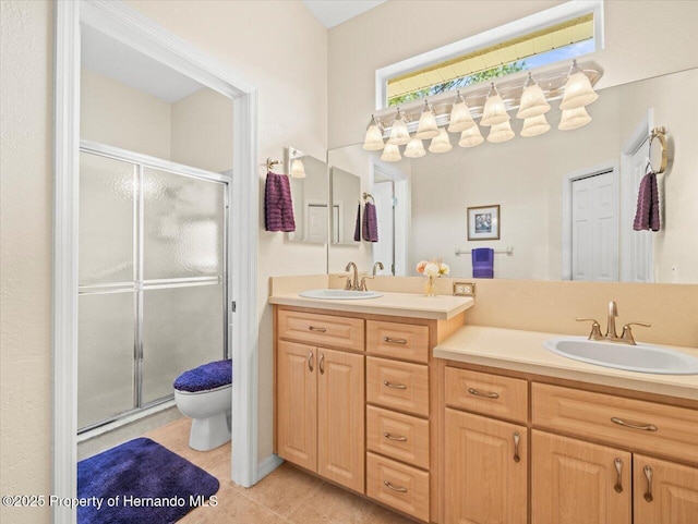 bathroom with vanity, an enclosed shower, tile patterned floors, and toilet