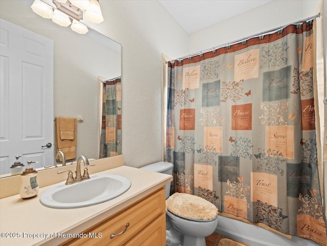 bathroom featuring a shower with curtain, vanity, and toilet