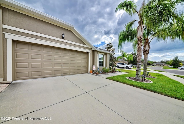 view of front facade with a garage and a front yard