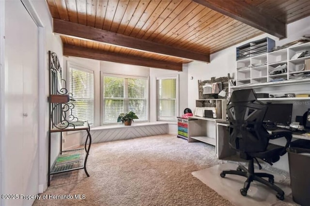 carpeted office space featuring beam ceiling and wood ceiling