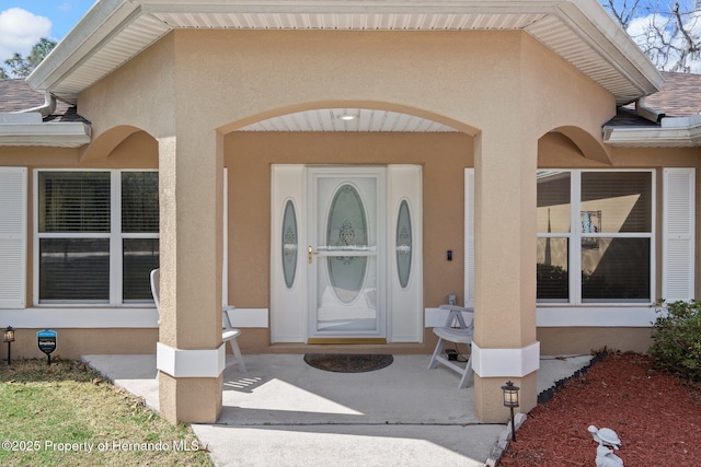 doorway to property with a patio