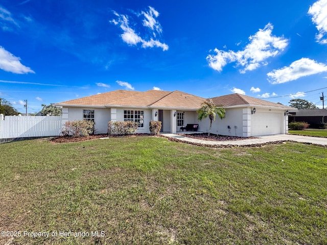 ranch-style home featuring a garage and a front yard