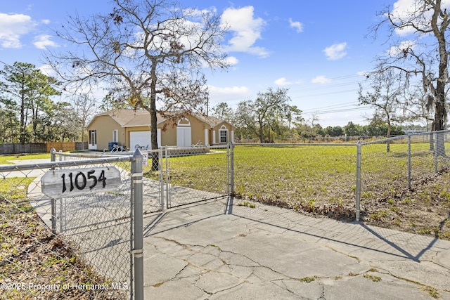 exterior space featuring a front lawn and a garage