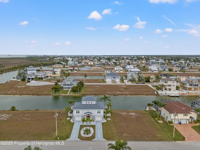 aerial view with a water view and a residential view