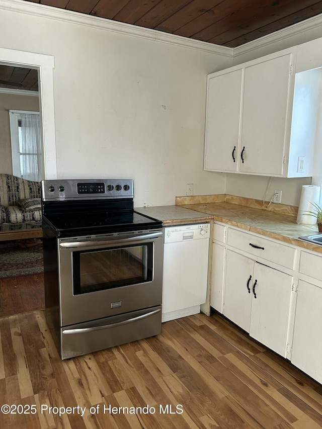 kitchen featuring white cabinetry, stainless steel electric range, white dishwasher, and wood-type flooring