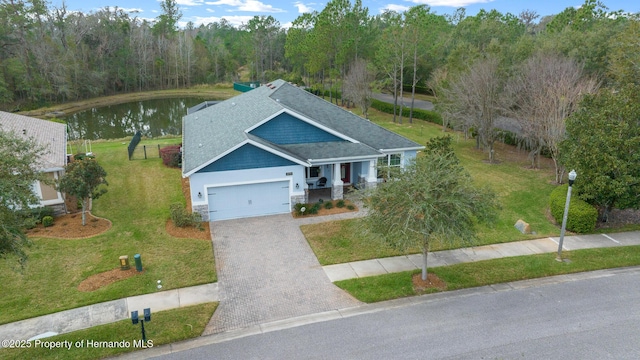 birds eye view of property featuring a water view