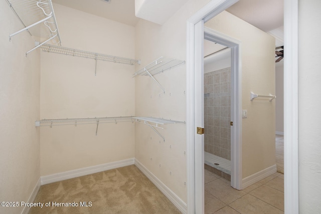 walk in closet featuring light tile patterned floors