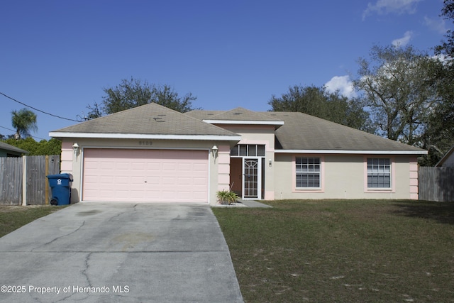 ranch-style home with fence, a front lawn, concrete driveway, and stucco siding