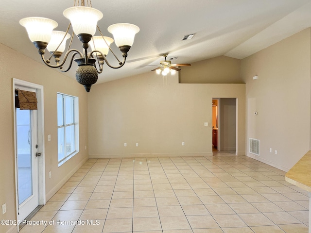 spare room featuring ceiling fan with notable chandelier, visible vents, vaulted ceiling, and light tile patterned floors