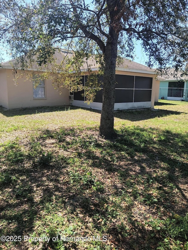 view of yard with a sunroom