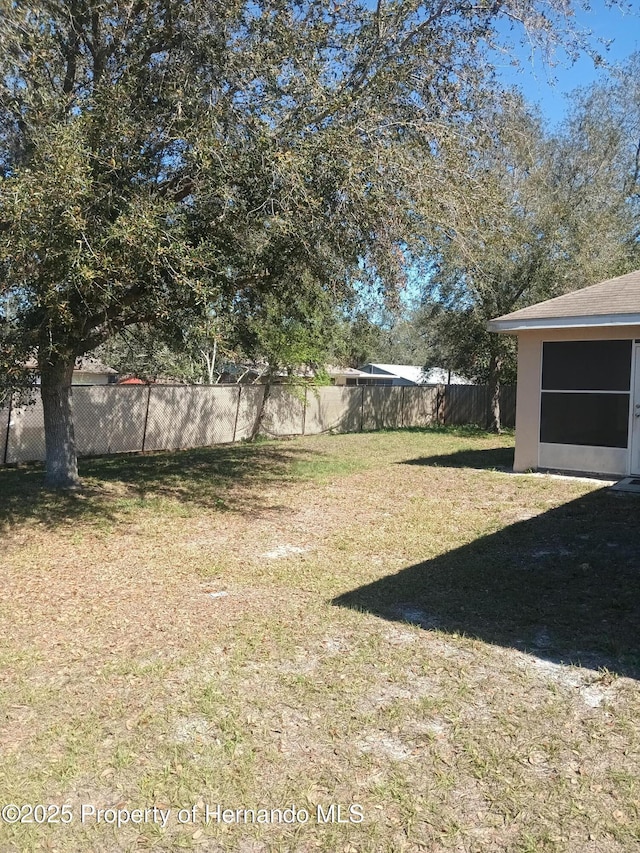 view of yard with a fenced backyard