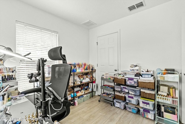 office with light hardwood / wood-style floors