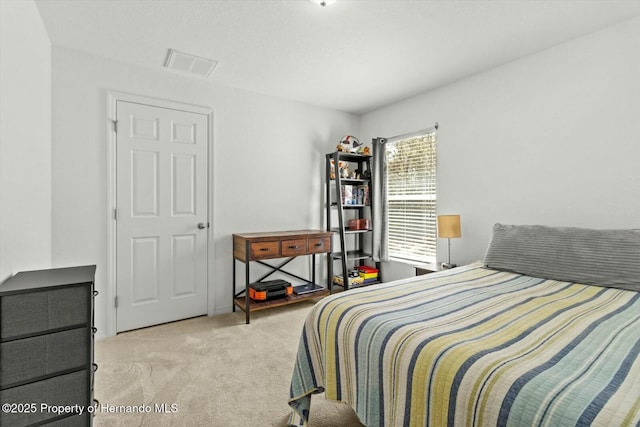 bedroom featuring light colored carpet