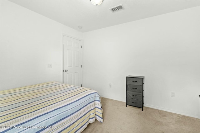 bedroom with light colored carpet