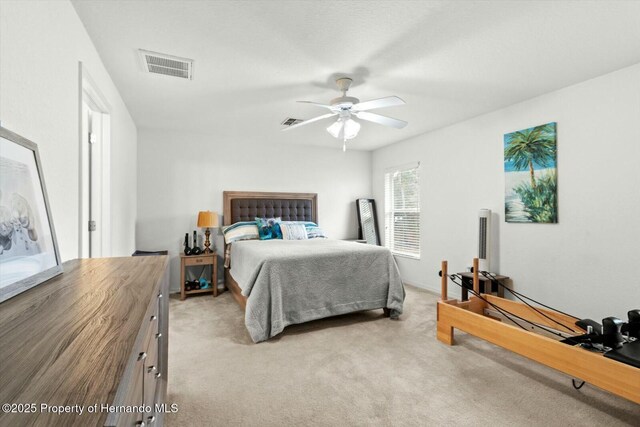 carpeted bedroom with ceiling fan