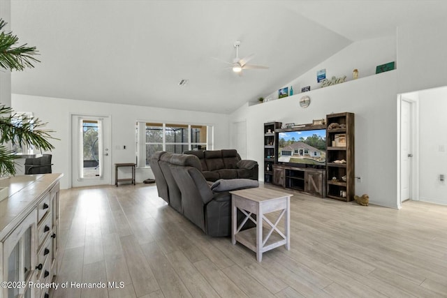 living room featuring high vaulted ceiling, ceiling fan, and light hardwood / wood-style flooring