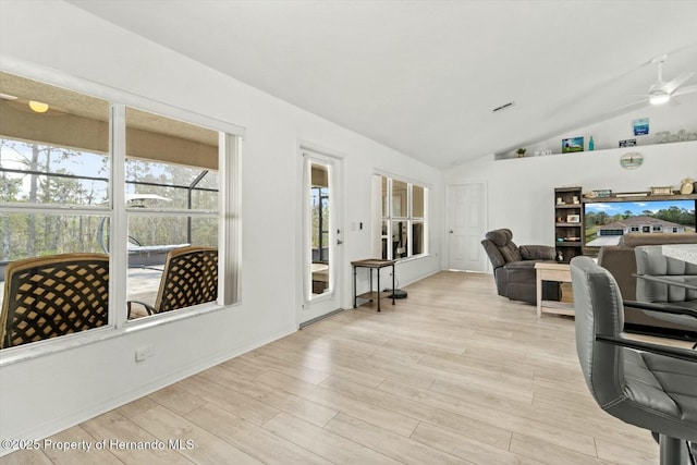 office featuring ceiling fan, lofted ceiling, and light hardwood / wood-style floors