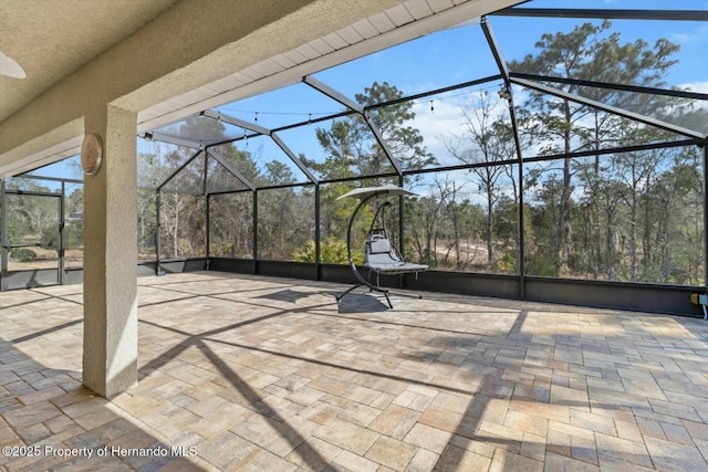 view of patio / terrace with a lanai