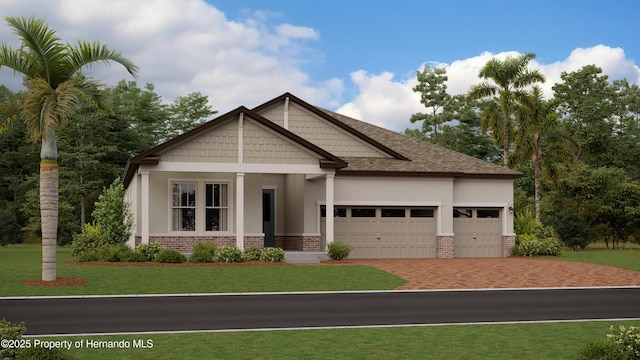 craftsman house featuring a front lawn and a garage