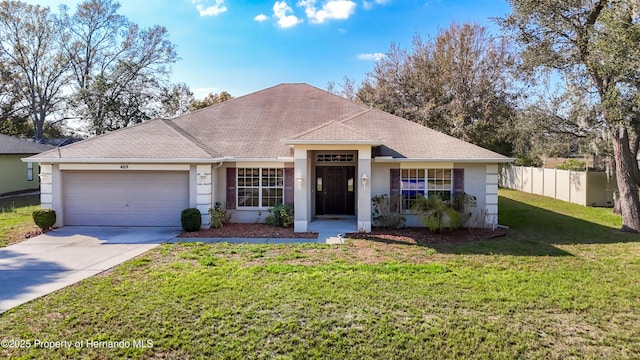 ranch-style house with a garage and a front yard