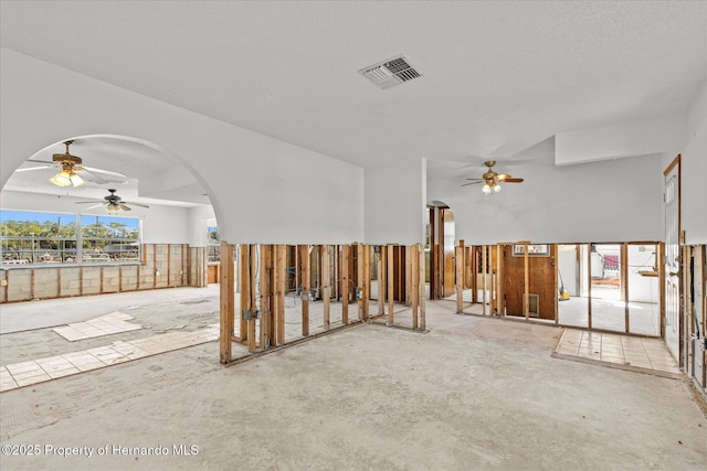 spare room with a textured ceiling and ceiling fan