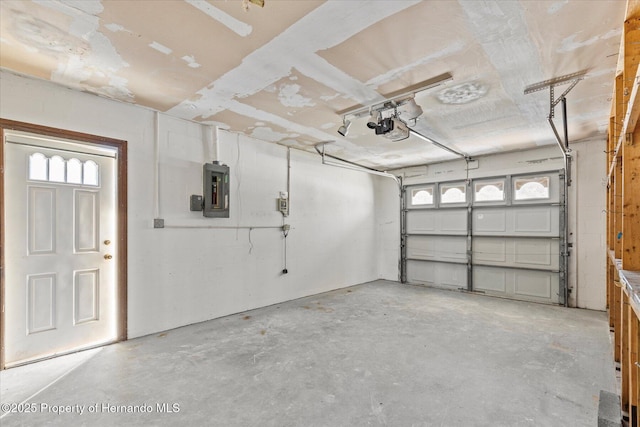 garage featuring a garage door opener and electric panel