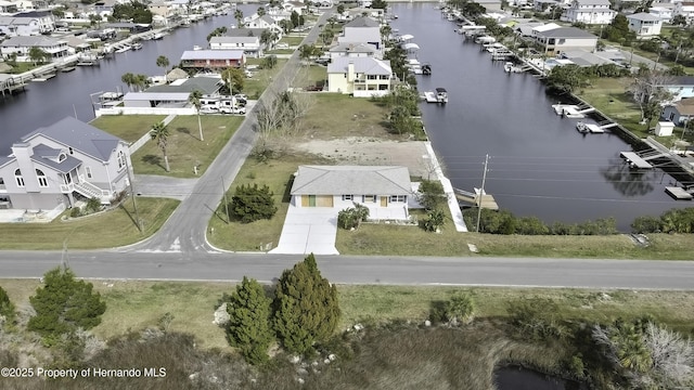 bird's eye view featuring a water view and a residential view