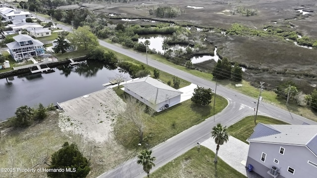 bird's eye view with a water view and a residential view