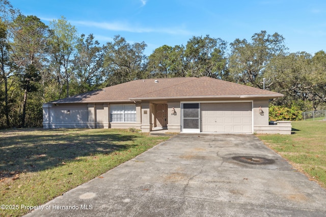 ranch-style home with a front lawn and a garage