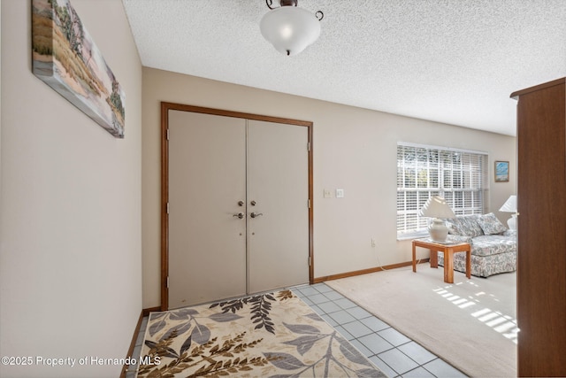 entrance foyer with a textured ceiling