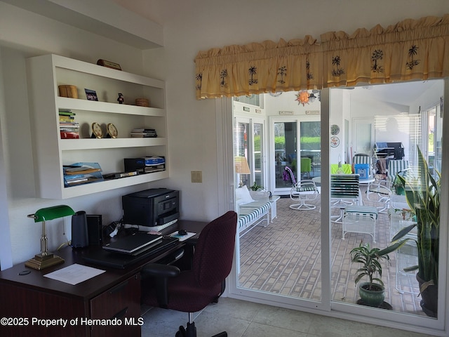 office with a healthy amount of sunlight and light tile patterned flooring