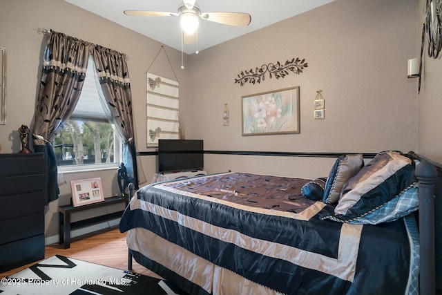 bedroom featuring ceiling fan and light wood finished floors