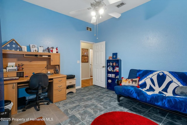 office space featuring baseboards, visible vents, and a ceiling fan