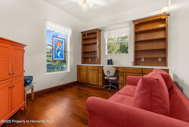 office space featuring dark wood-style floors, baseboards, and a ceiling fan