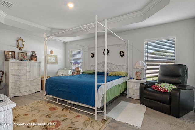 bedroom with carpet, visible vents, and crown molding