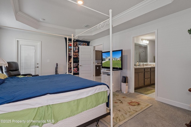 bedroom with crown molding, visible vents, light carpet, connected bathroom, and baseboards