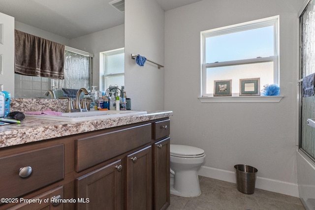 bathroom with baseboards, visible vents, vanity, and toilet