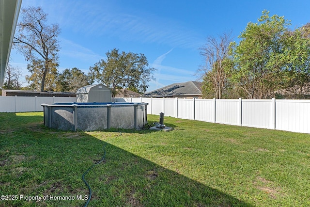 view of yard featuring a fenced backyard and a fenced in pool