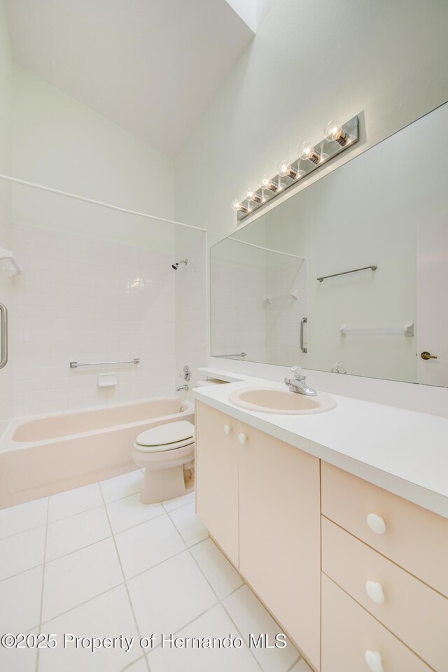 full bathroom featuring toilet, shower / tub combination, vanity, and tile patterned floors