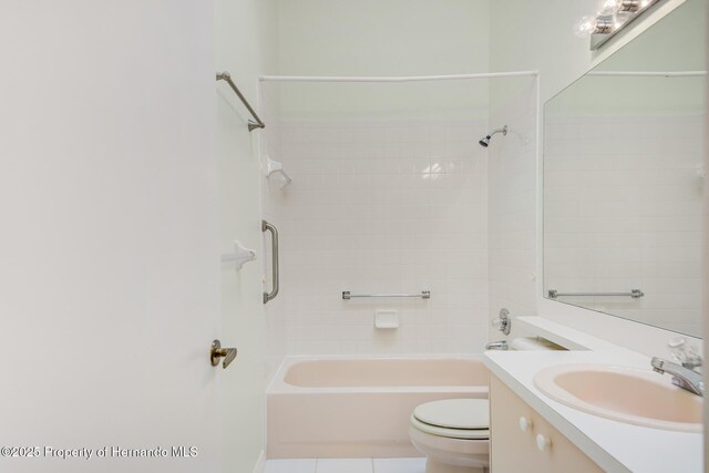 bathroom with shower / bath combination, vanity, toilet, and tile patterned floors