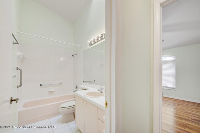 full bath with toilet, shower / washtub combination, vanity, and tile patterned floors